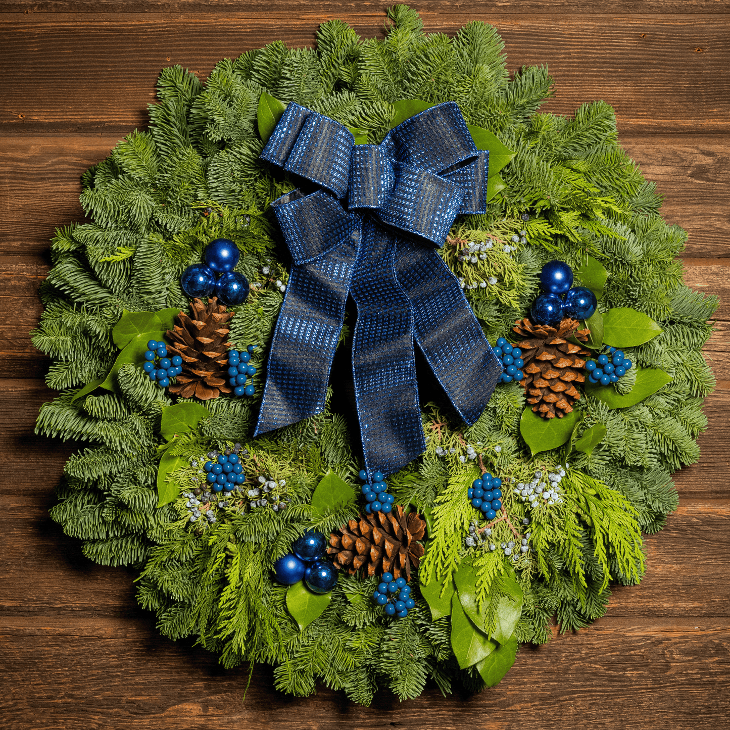 Blue Bow with Blue Balls and Berries on evergreen wreath