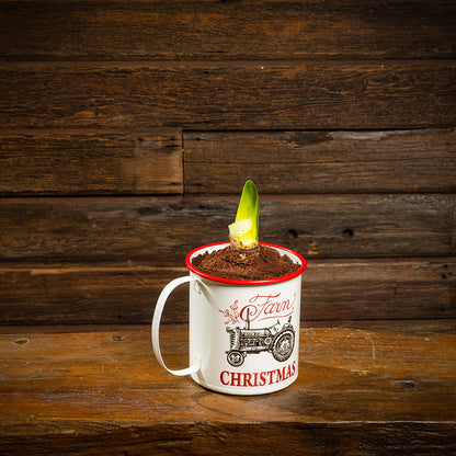 amaryllis bulb, soil disc, and a metal farm-themed mug container with handle