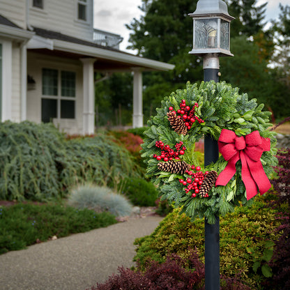 Red Berries and red linen bow on evergreen wreath