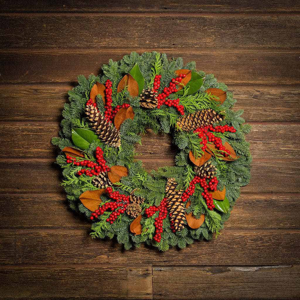 Red Berries and Magnolia on evergreen wreath