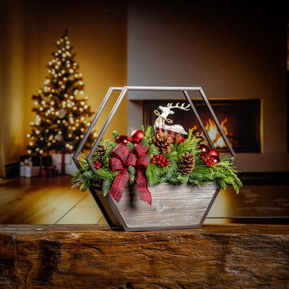 Decorative Christmas scene with a geometric lantern, bow, and pinecones on a wooden surface.