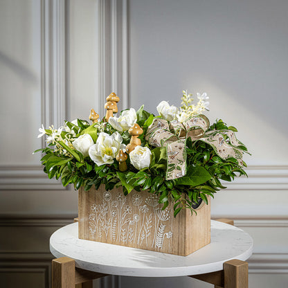 Fresh salal and green huckleberry with faux white tulips, faux white small flowers, faux white hellebores flowers, faux wood mushrooms, and a fern & mushroom bow in a wildflower-themed wooden box