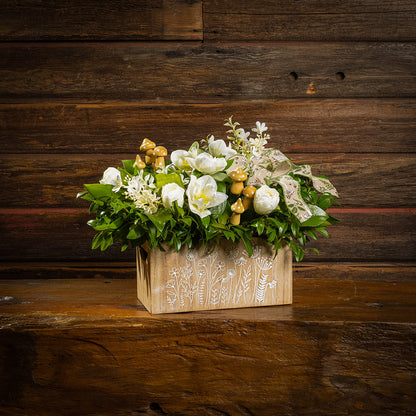 Fresh salal and green huckleberry with faux white tulips, faux white small flowers, faux white hellebores flowers, faux wood mushrooms, and a fern & mushroom bow in a wildflower-themed wooden box