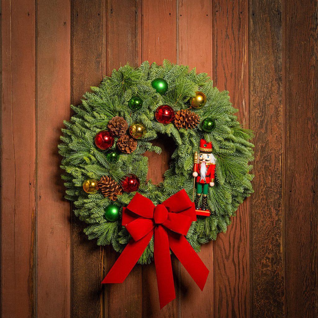 Christmas wreath with decorations on a wooden door