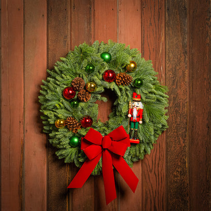 Christmas wreath with decorations on a wooden door