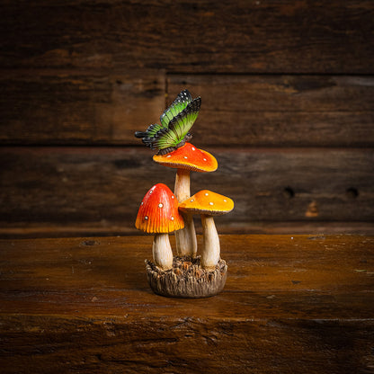 a resin mushroom & butterfly decoration