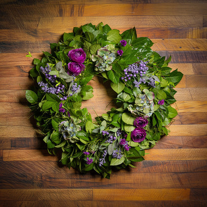 Fresh salal and sweet huckleberry with faux purple ranunculus flowers, purple statice, faux purple hydrangeas, and faux light-purple berries