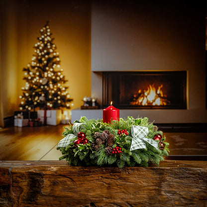 noble fir, cedar, pine, and variegated holly with red ball ornaments, faux red berries, natural pinecones, green-and-white plaid bow tucks, and a red metallic pillar candle