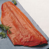 Smoked salmon with rosemary on a slab
