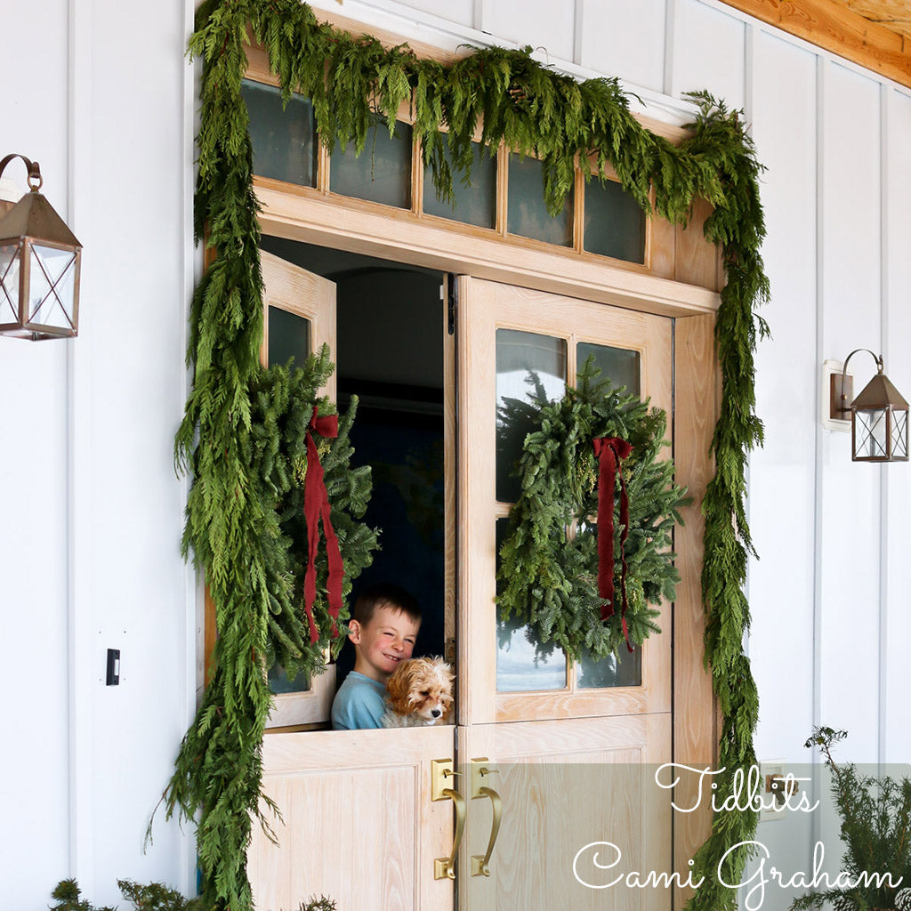 Western red cedar garland hung around a front door.