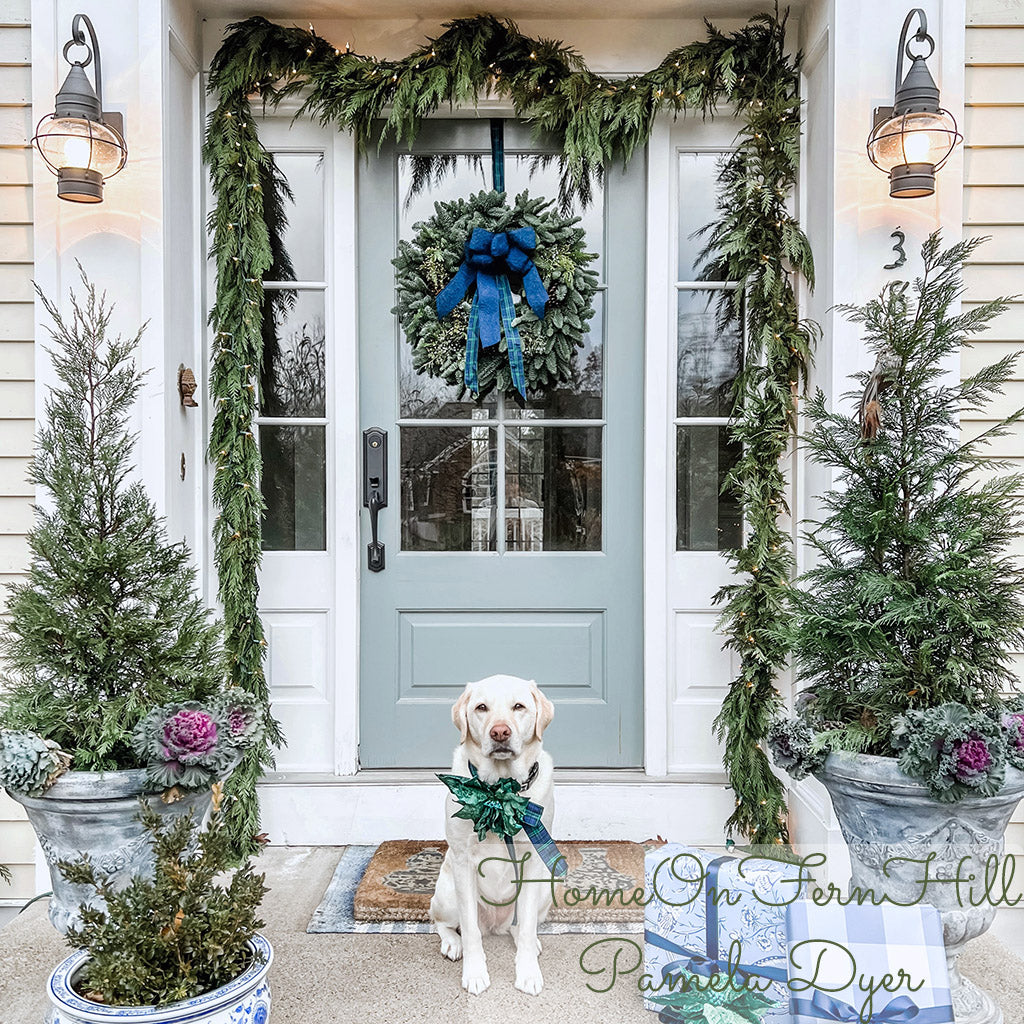 Western red cedar garland hung around a front door.