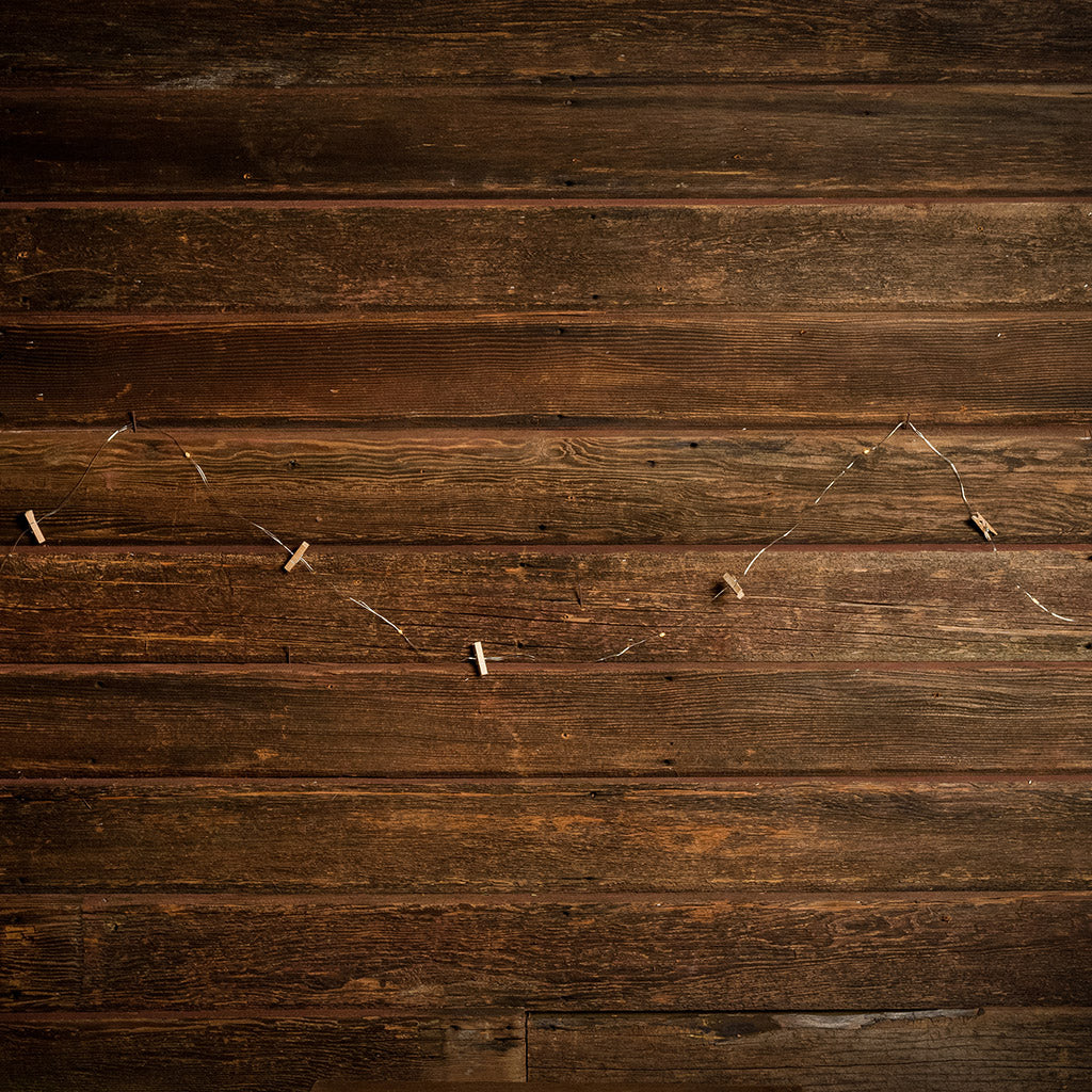 10-foot strand of white lights and mini wood clothespins with a dark wooden background.