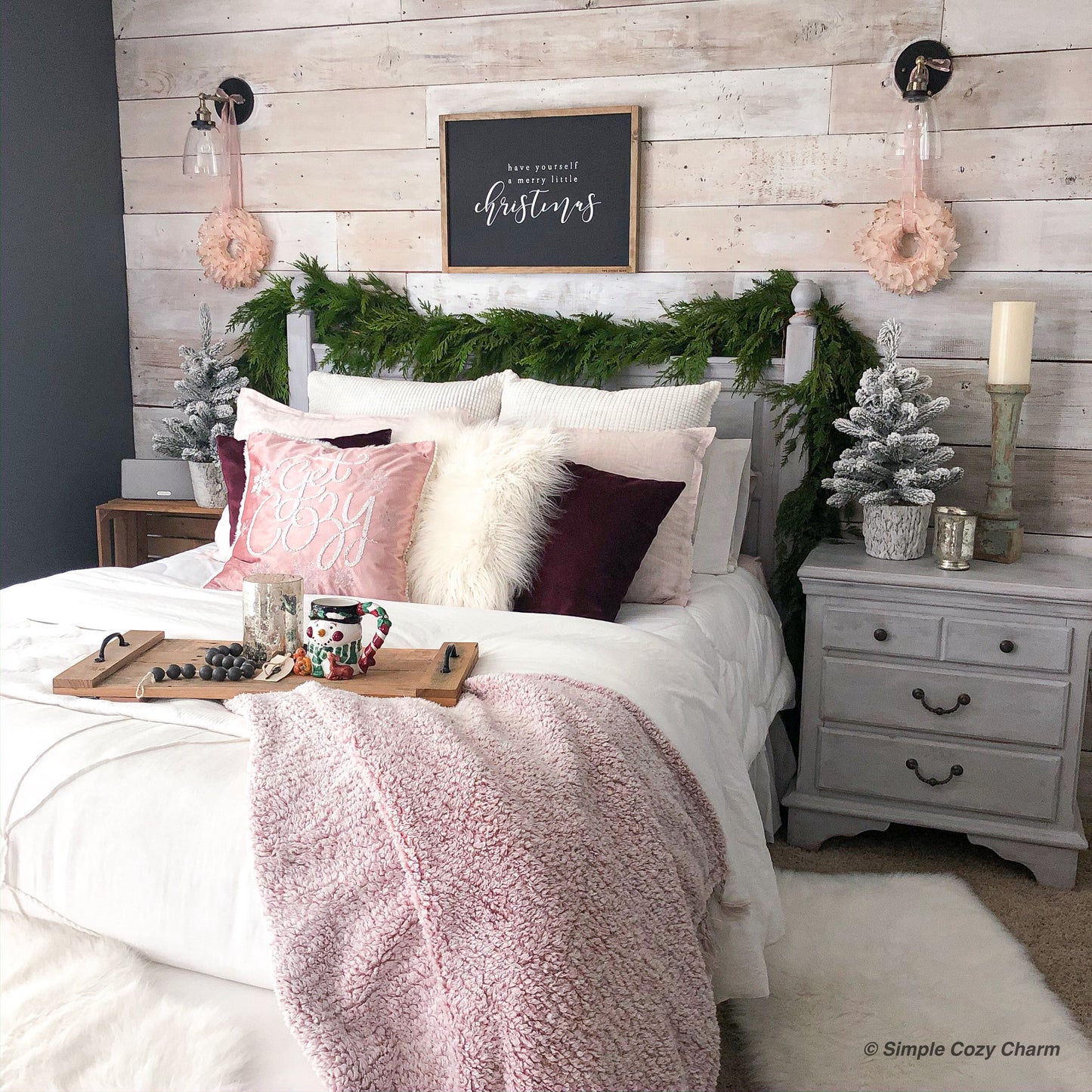 Western red cedar garland draped over a white wooden headboard.