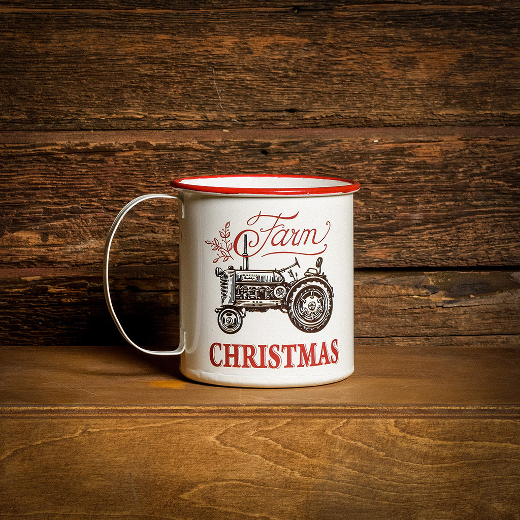 A 6.25" white “Farm Christmas” mug sitting on a shelf with a dark wooden background.