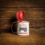A 6.25" white “Farm Christmas” mug showcased with cooking utensils inside sitting on a shelf with a dark wooden background.