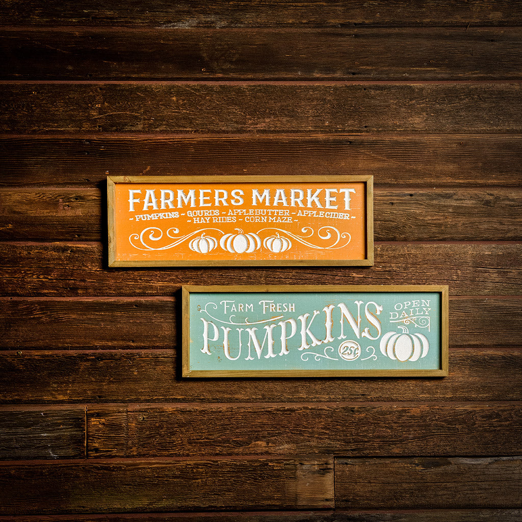 Set of 2 fall signs for Farmers Market and Pumpkins hung on a wooden background.