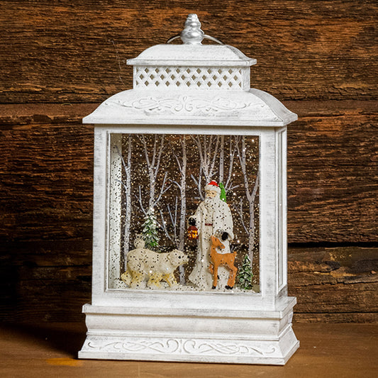 A Lighted Water Globe in white of Father Christmas with forest animals and snow-covered trees with a dark wood background.