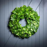 Hand picked fresh salal wreath on wooden background