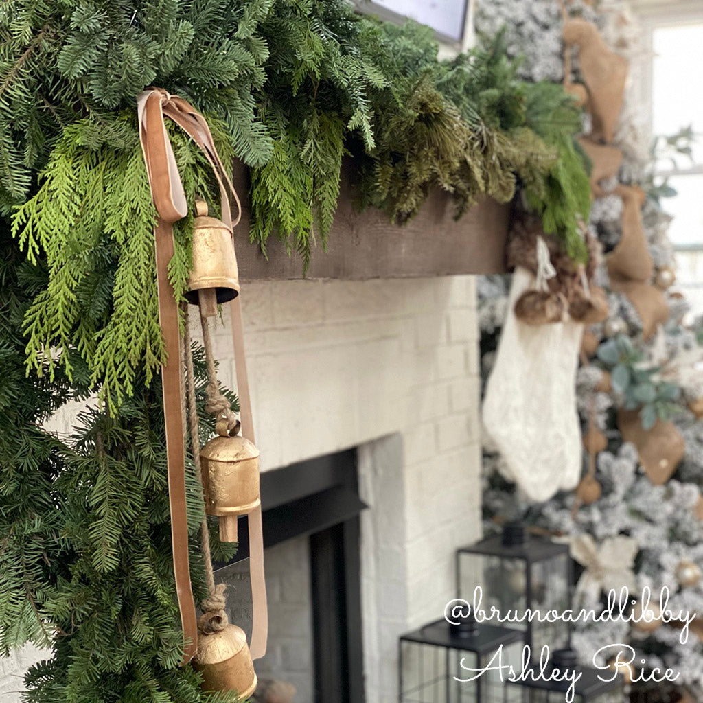 Fresh Premium garland combination of noble fir, incense and western red cedar and white pine is ultra fragrant draped over a fireplace mantel.