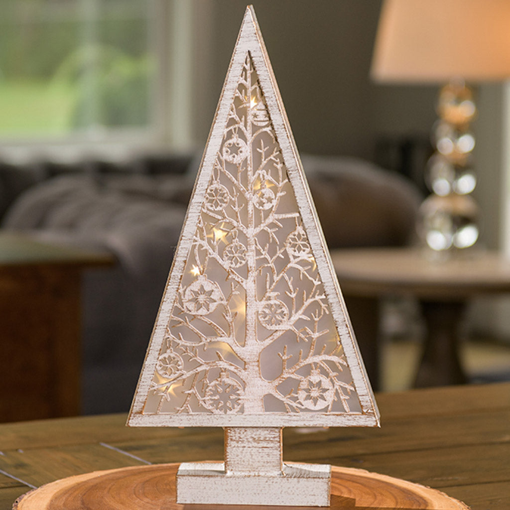 Tree shaped home decor with battery operated lights on wooden tabletop